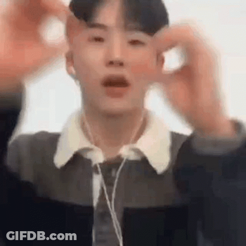 Young Man In Headphones And Jacket Making Funny Face GIF