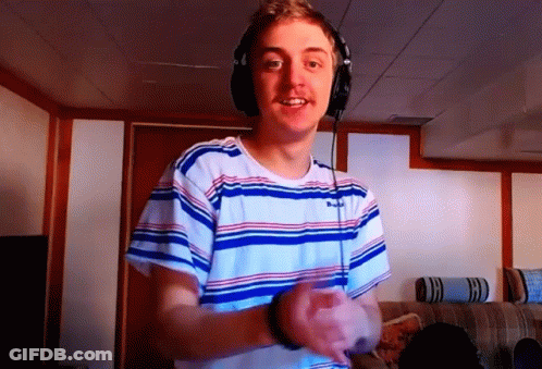 Young Man In Headphones And Striped Shirt Smiling GIF