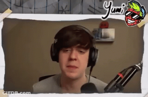 Young Man In Headphones And Sunglasses At Microphone GIF