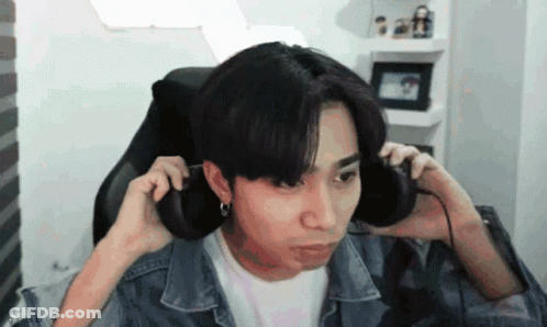 Young Man In Headphones Making Funny Face GIF