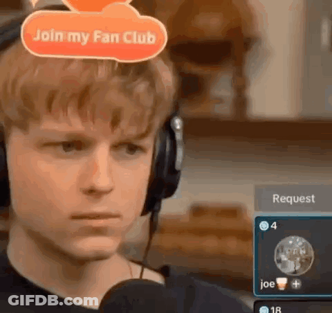 Young Man In Headphones Talking Into Microphone With Join My Fan Club Sign GIF