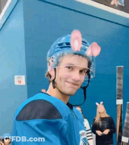Young Man In Hockey Helmet With Bunny Ears GIF