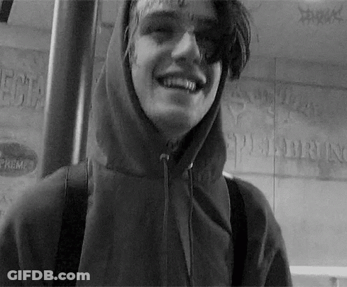 Young Man In Hooded Jacket Smiling GIF
