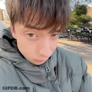 Young Man In Jacket Close Up GIF