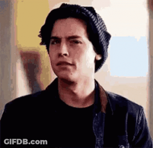 Young Man In Knitted Hat And Black Shirt GIF