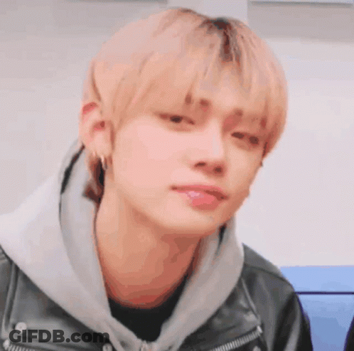 Young Man In Leather Jacket And Hoodie GIF