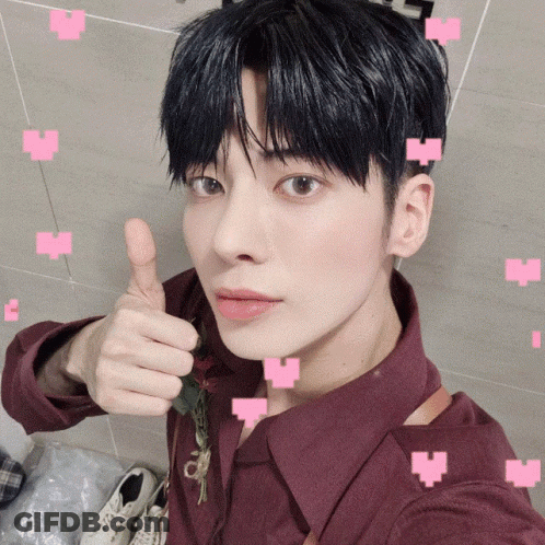 Young Man In Maroon Shirt Giving Thumbs Up GIF
