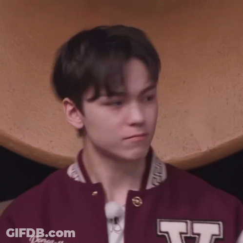 Young Man In Maroon Varsity Jacket And White Shirt GIF
