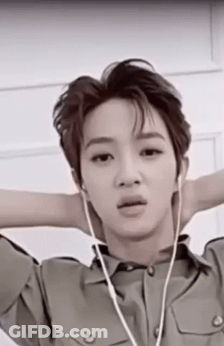 Young Man In Military Uniform With Headphones GIF