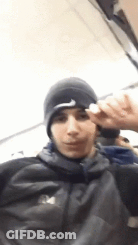 Young Man In Nike Hat And North Face Jacket GIF