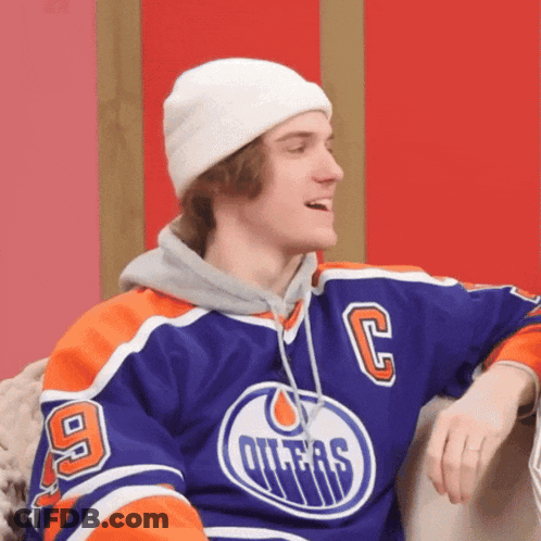 Young Man In Oilers Jersey And White Beanie GIF
