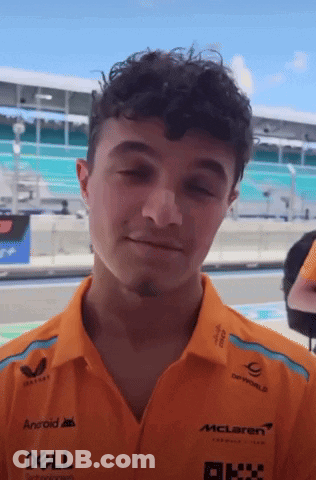 Young Man In Orange Dell And McLaren Shirt GIF