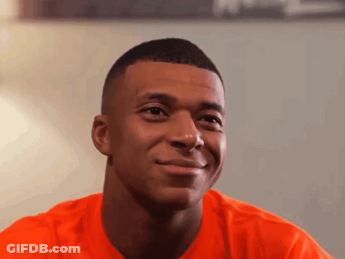 Young Man In Orange Shirt Smiling GIF