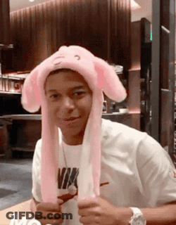 Young Man In Pink Bunny Hat And White Nike Shirt GIF