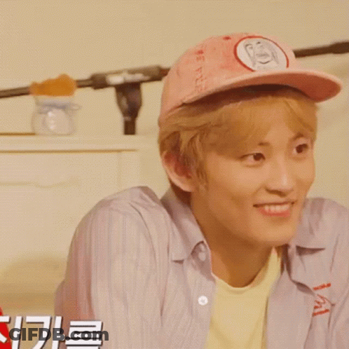 Young Man In Pink Hat With Letter S Smiling GIF