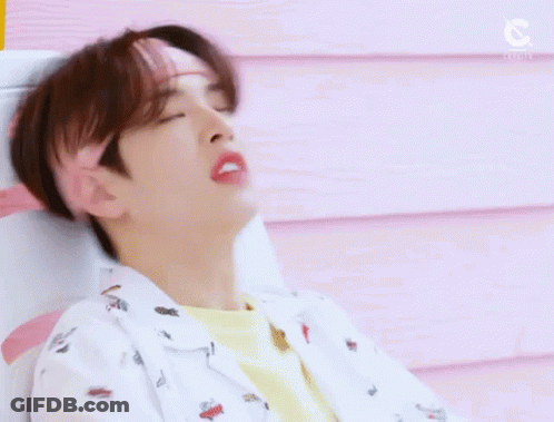 Young Man In Pink Headband And Yellow Shirt GIF