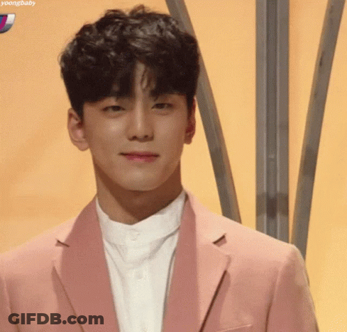 Young Man In Pink Jacket Smiling GIF