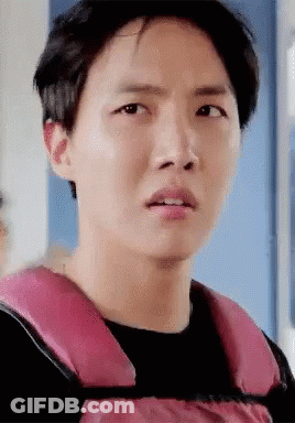Young Man In Pink Life Vest Making Funny Face GIF