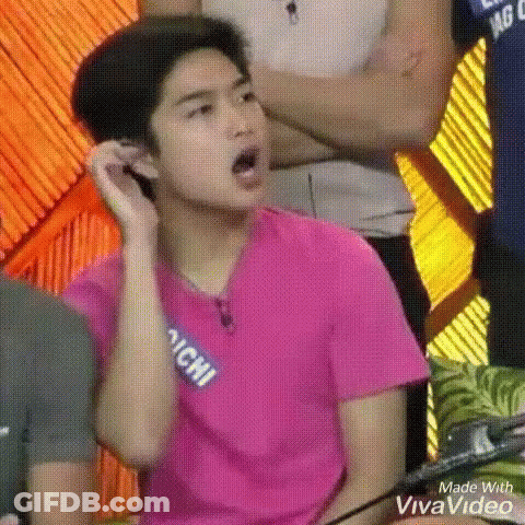 Young Man In Pink Shirt Making Funny Face GIF