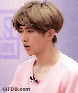 Young Man In Pink Shirt With Headband And Microphone GIF