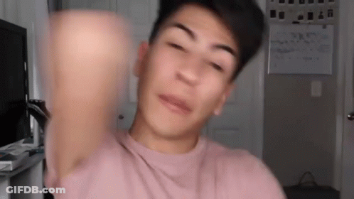 Young Man In Pink T-Shirt Making Funny Face GIF