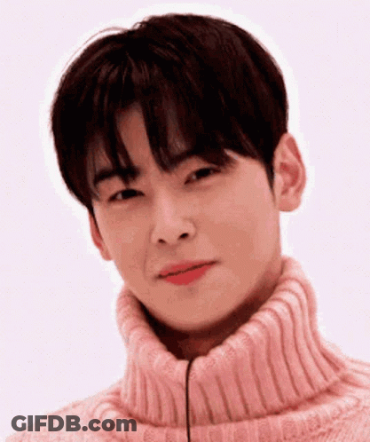 Young Man In Pink Turtleneck Smiling GIF