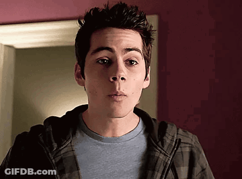 Young Man In Plaid Hoodie And Blue Shirt GIF