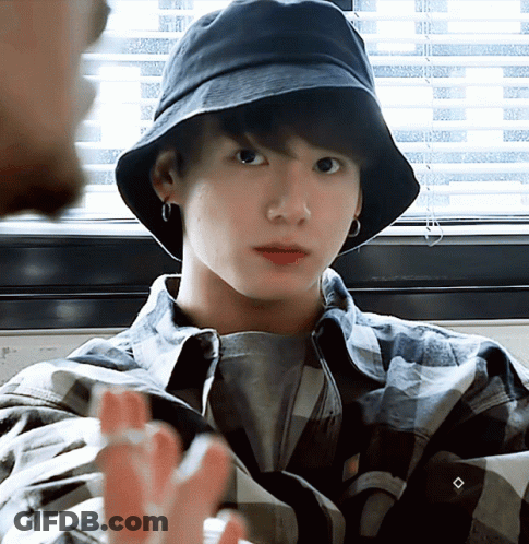 Young Man In Plaid Shirt And Black Bucket Hat GIF