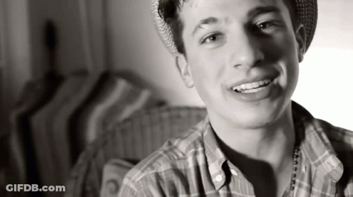 Young Man In Plaid Shirt And Hat Smiling GIF