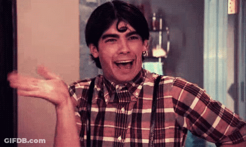 Young Man In Plaid Shirt And Suspenders Laughing GIF