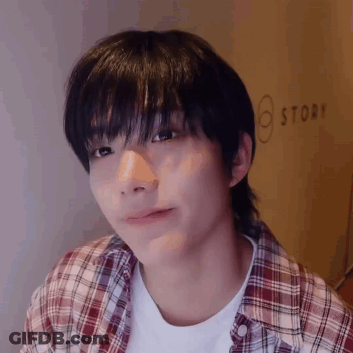 Young Man In Plaid Shirt And White Shirt GIF