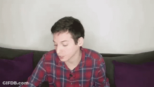Young Man In Plaid Shirt Drinking Red Cup GIF