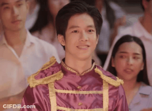 Young Man In Purple And Gold Uniform Before Crowd GIF
