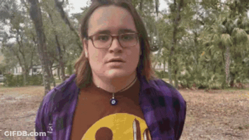Young Man In Purple Plaid Shirt GIF