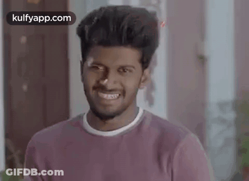 Young Man In Purple Shirt Smiling GIF