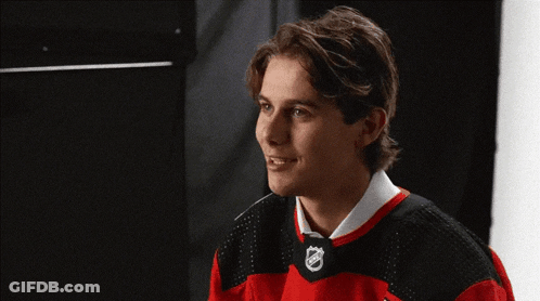 Young Man In Red And Black NHL Jersey GIF