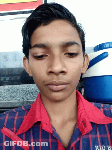 Young Man In Red And Blue Plaid Shirt With KDB On Sleeve GIF