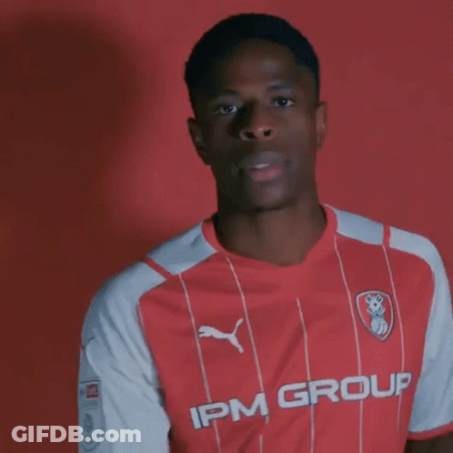 Young Man In Red And White Striped IPM Group Shirt GIF
