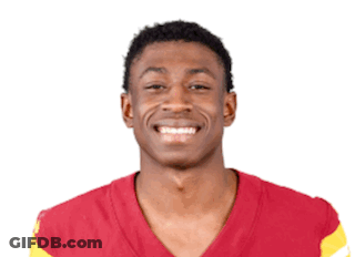 Young Man In Red And Yellow Jersey Smiling GIF