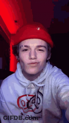 Young Man In Red Hat And White Hoodie GIF
