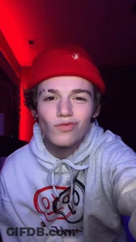 Young Man In Red Hat And White Hoodie GIF