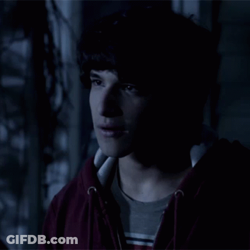 Young Man In Red Hoodie And Striped Shirt GIF