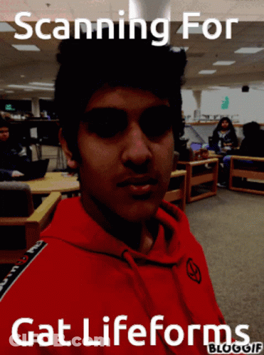 Young Man In Red Hoodie Scanning For Gat Life Forms GIF