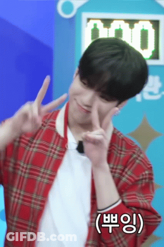 Young Man In Red Plaid Jacket Making Peace Sign GIF