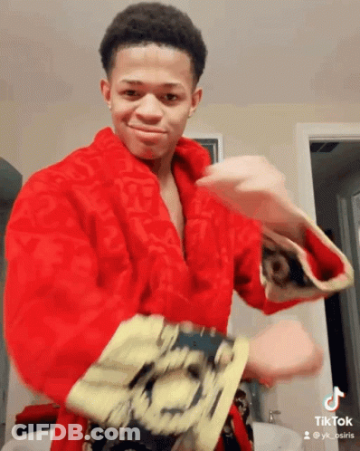 Young Man In Red Robe With TikTok Account GIF