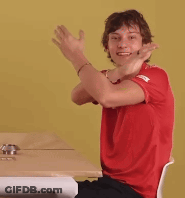 Young Man In Red Shirt Head Down At Table GIF