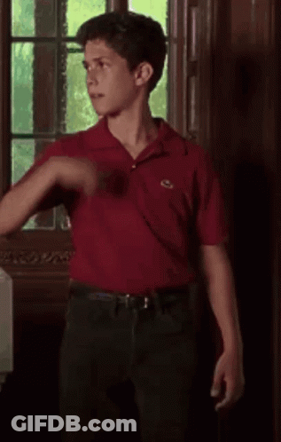 Young Man In Red Shirt Holding Light Stick Around Neck GIF