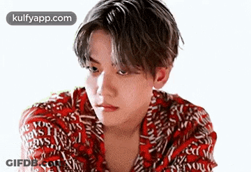 Young Man In Red Shirt Looking Serious GIF
