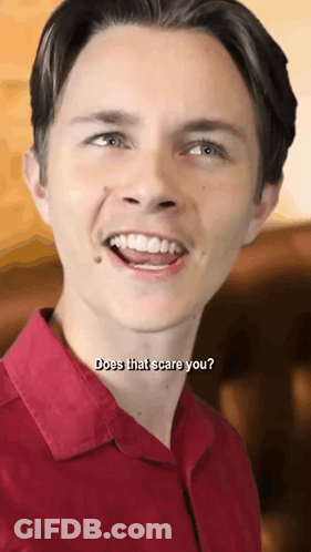 Young Man In Red Shirt Saying Does That Scare You GIF