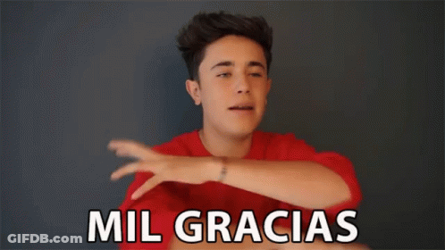 Young Man In Red Shirt Saying Mil Gracias GIF